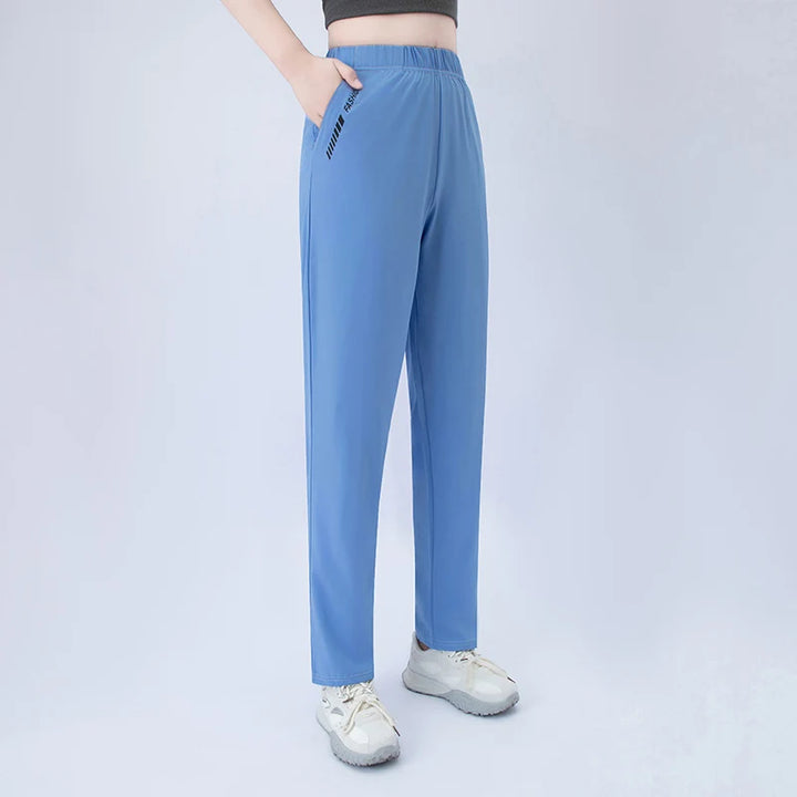 Blue wide-leg pocket pants with elastic waist and side graphic detail