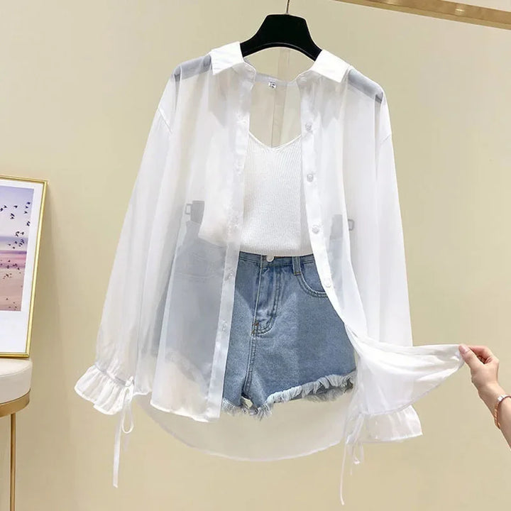 White sheer button-up long sleeve shirt with V-cut neckline and ruffled cuffs