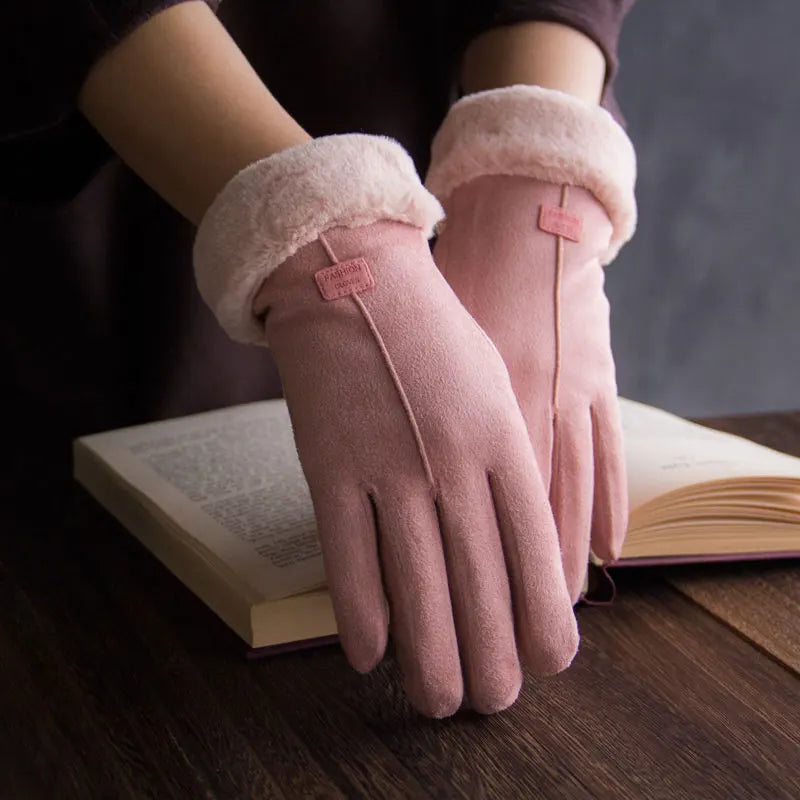 Pink suede-look gloves with plush cuffs worn on hands