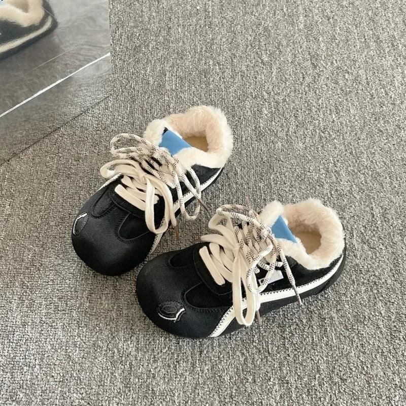 Black suede platform sneakers with faux fur lining, lace-up front, and white rubber sole