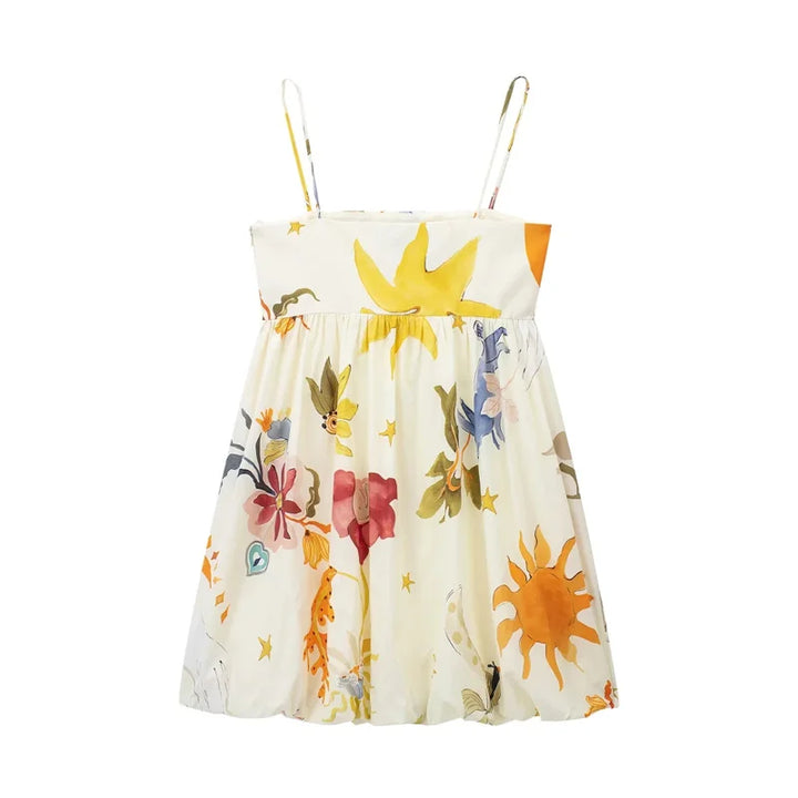 Children's dress with floral and sun pattern on a white background