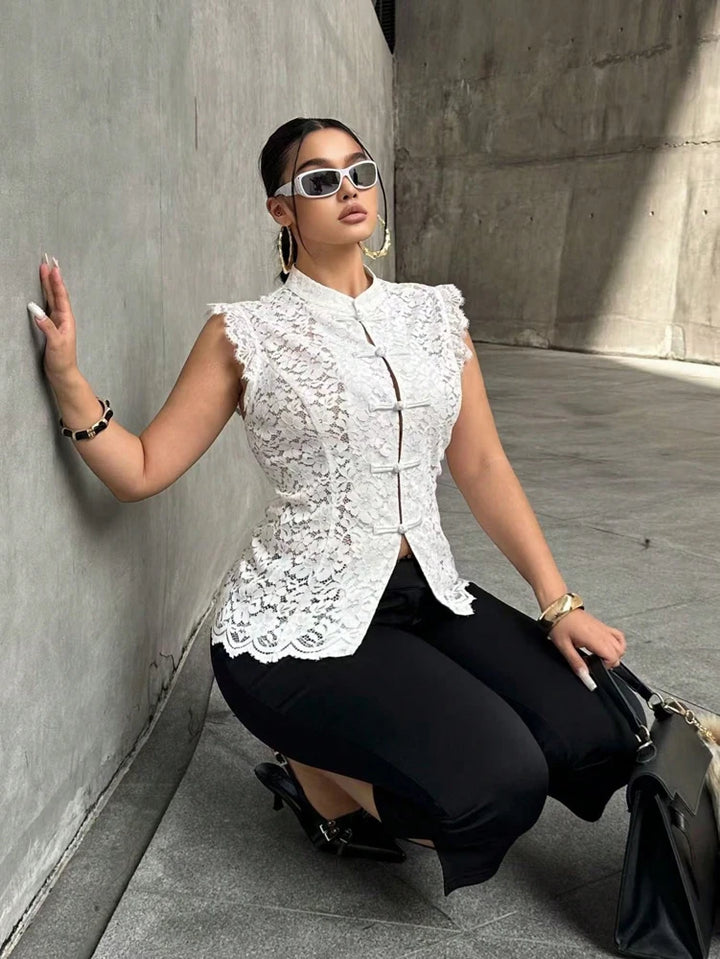 White sleeveless lace blouse with frog-button front and stand collar