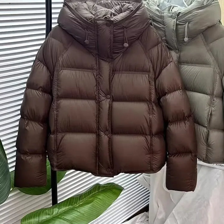 Dark brown hooded puffer coat with cotton padding and front zip closure