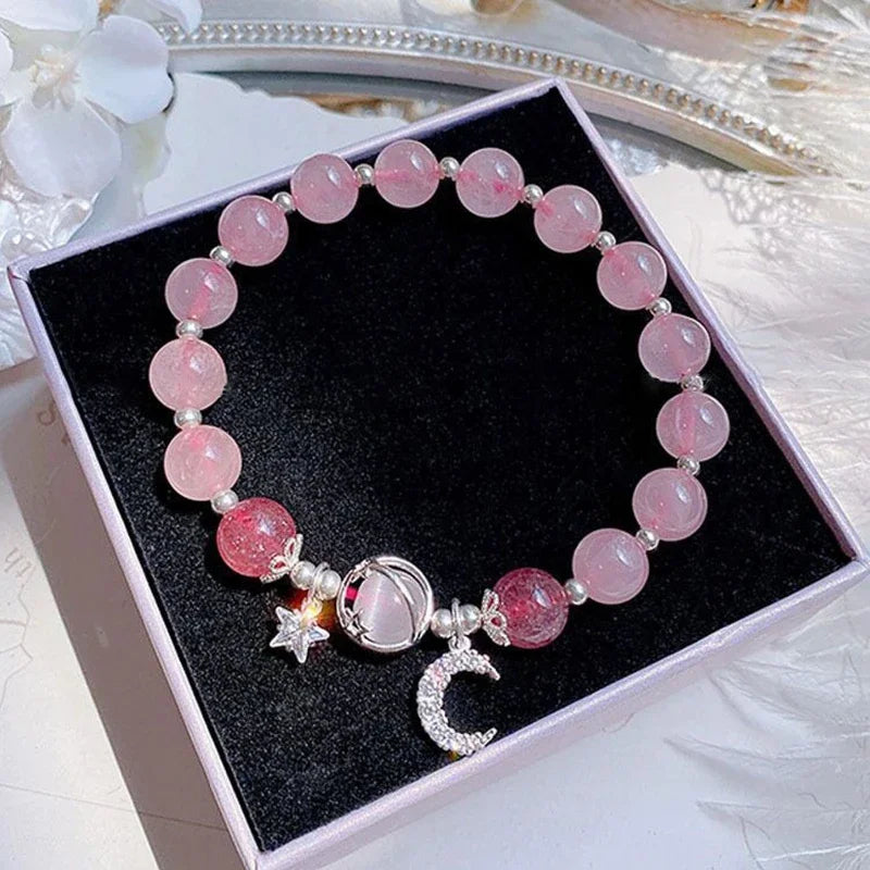 Pink bead elastic bracelet with star and crescent charms in a gift box