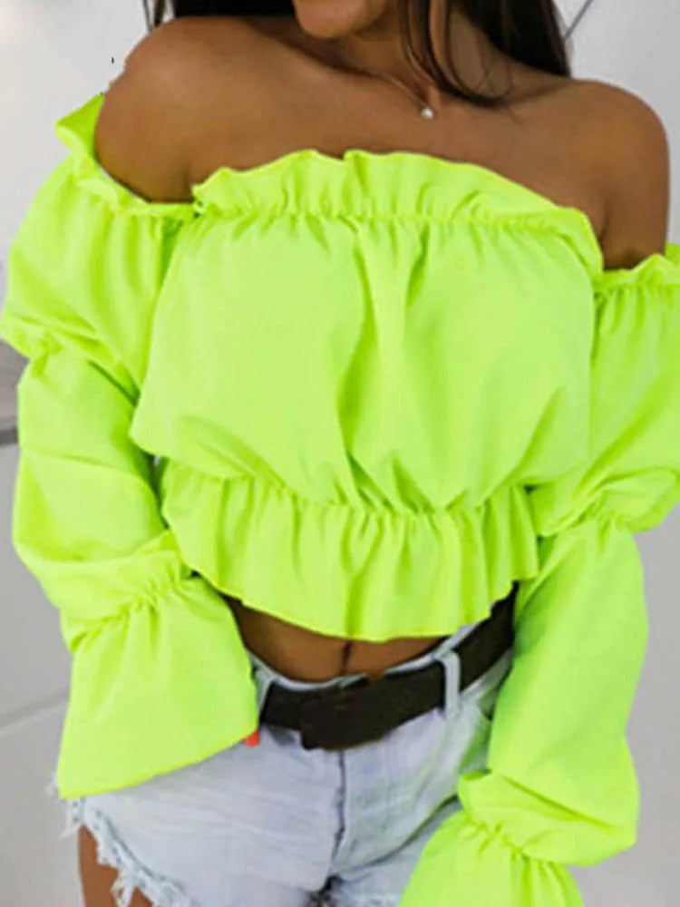 Neon green off-shoulder crop top with long puff sleeves and layered ruffles