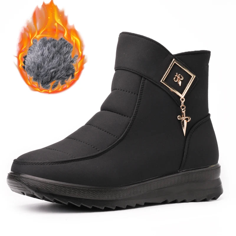 Black boot with gold charm on a white background, inset with close-up of gray insulation material.