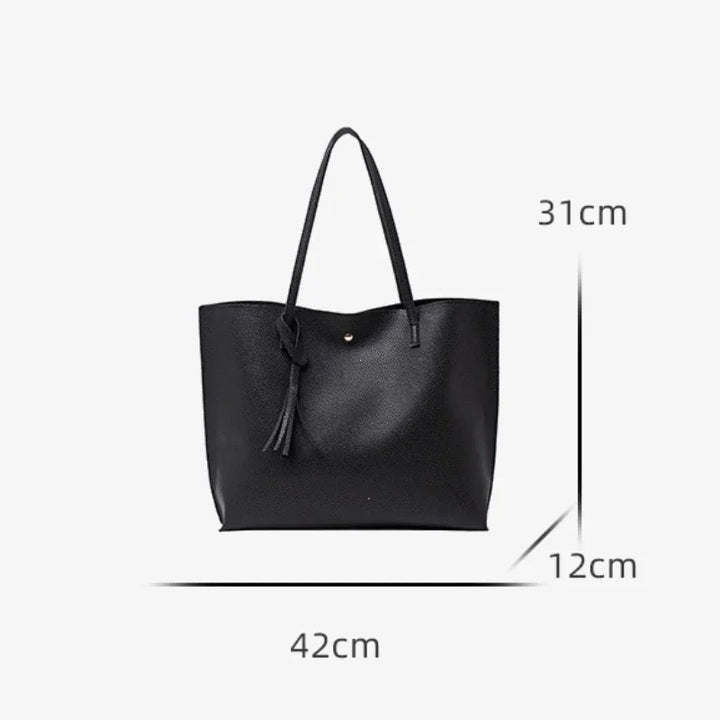 Black handbag with measurements on a white background