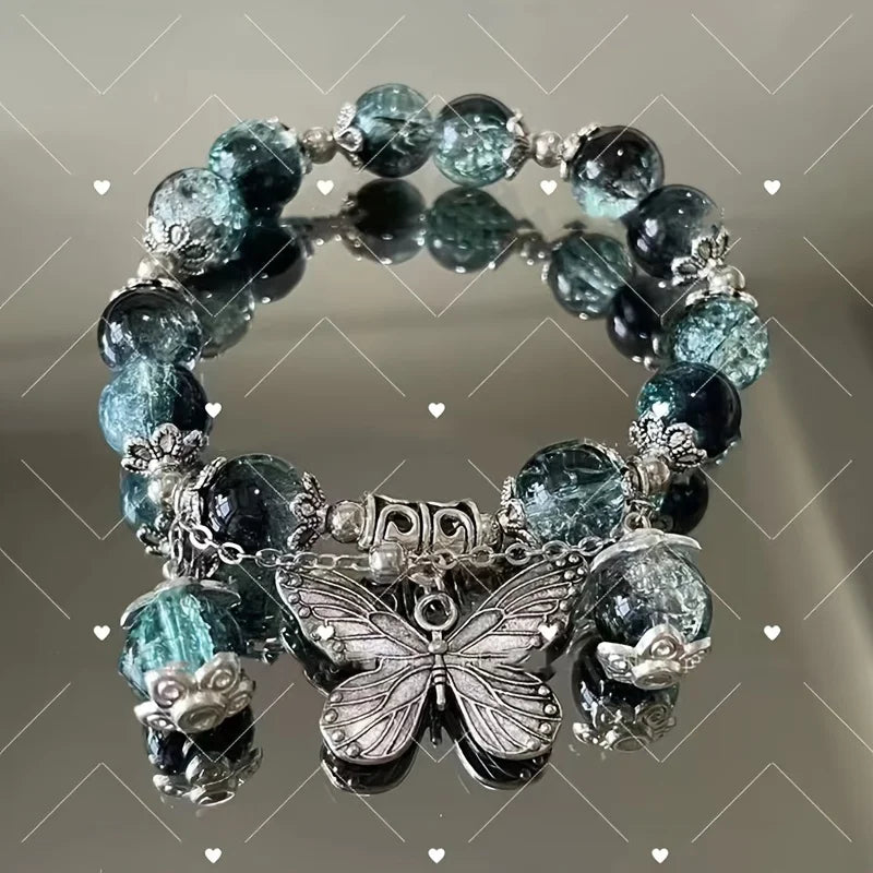 Butterfly charm bead bracelet with teal and dark glass beads and silver accents
