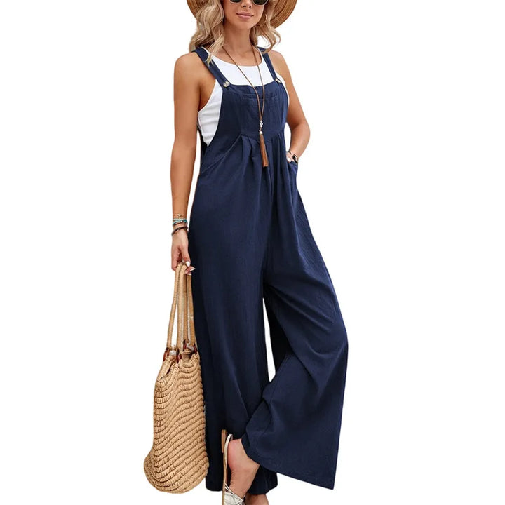 Navy sleeveless jumpsuit with adjustable straps and flowy wide-leg pants