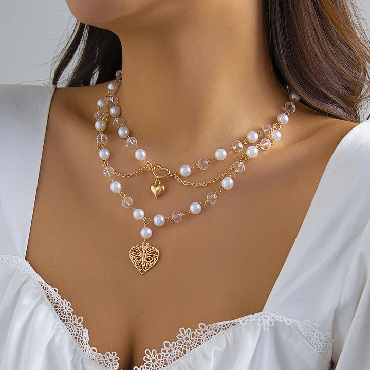 Ivory pearl layered necklace with heart charm and gold-tone chain drops