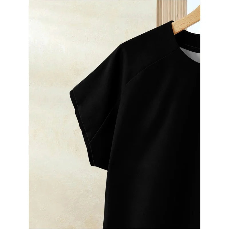 Close-up of the black top's short sleeve and shoulder seam