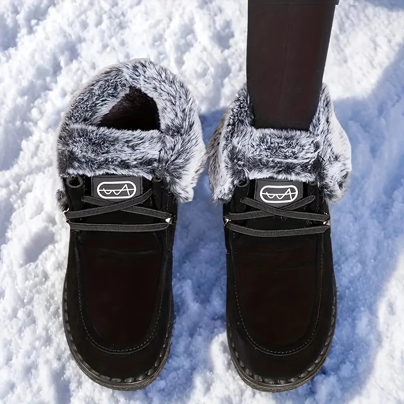 Women's black lace-up snow boots with faux-fur trim and thick lug sole