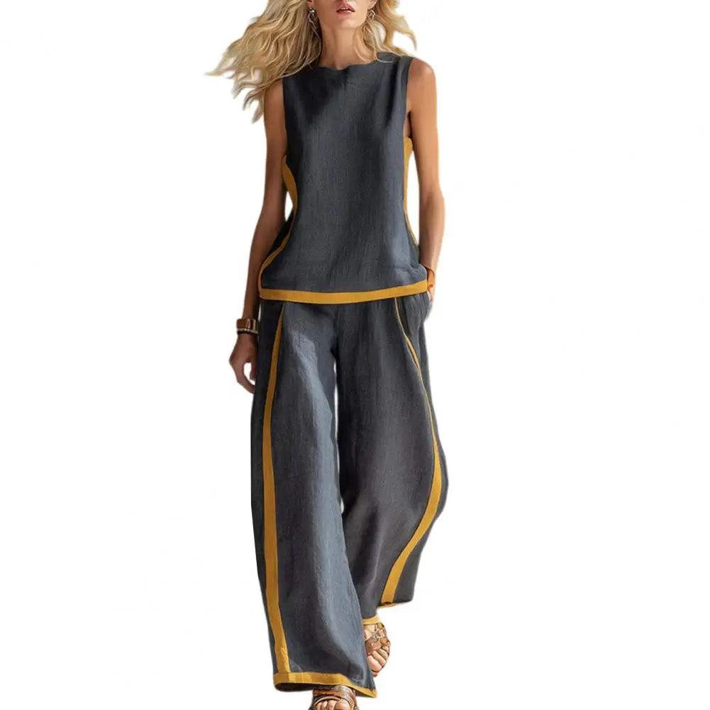 Dark gray sleeveless vest and wide-leg pants set with gold trim, front view