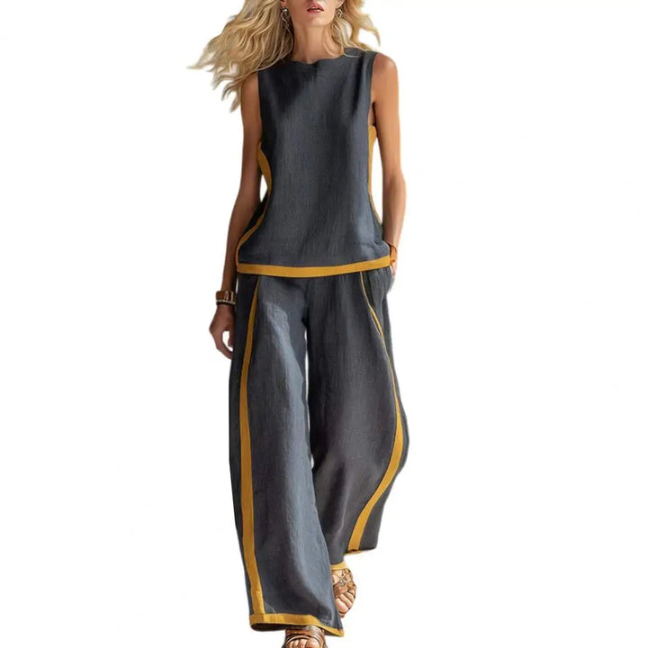 Dark gray sleeveless vest and wide-leg pants set with gold trim, front view
