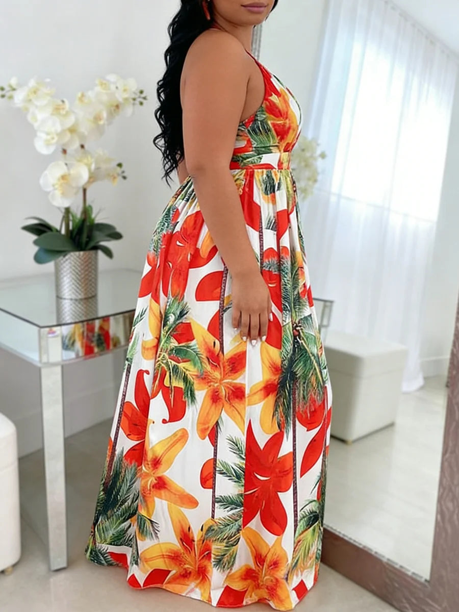 Woman wearing a floral dress in a room with a table and plant.
