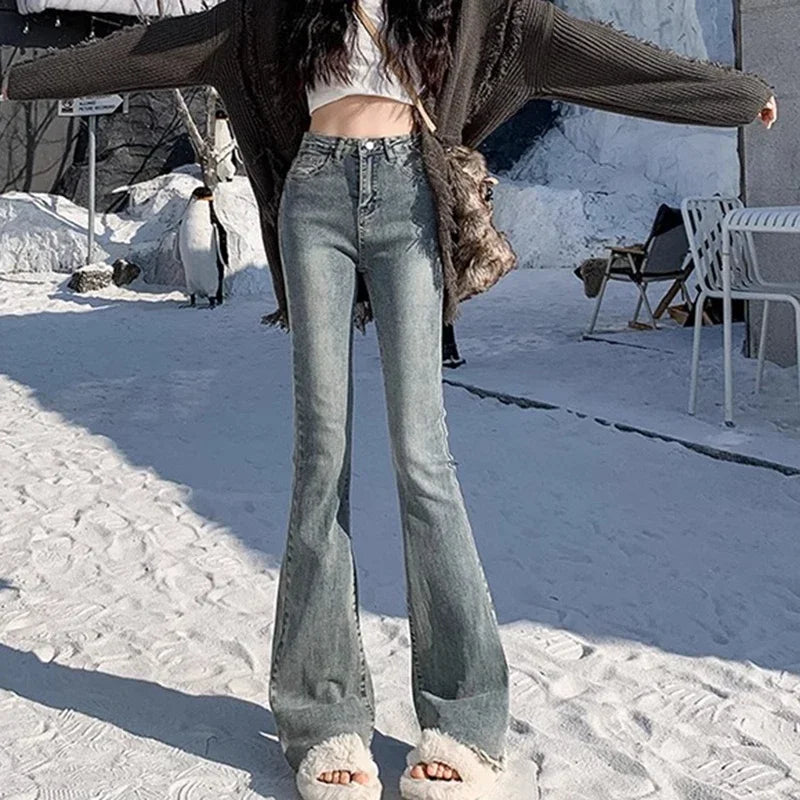 High-rise flare denim jeans, light blue wash, curve-hugging fit