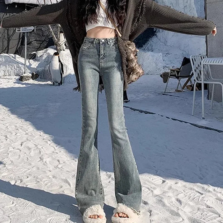 High-rise flare denim jeans, light blue wash, curve-hugging fit
