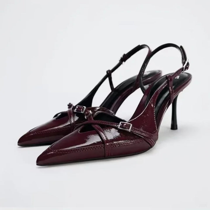 Pair of wine red open cross-strap pointed-toe slingback high heels with slim stiletto
