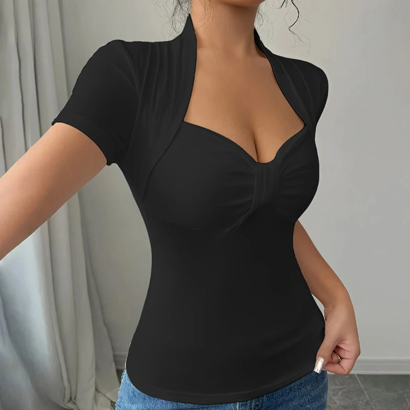 Person wearing a black top with a blurred background