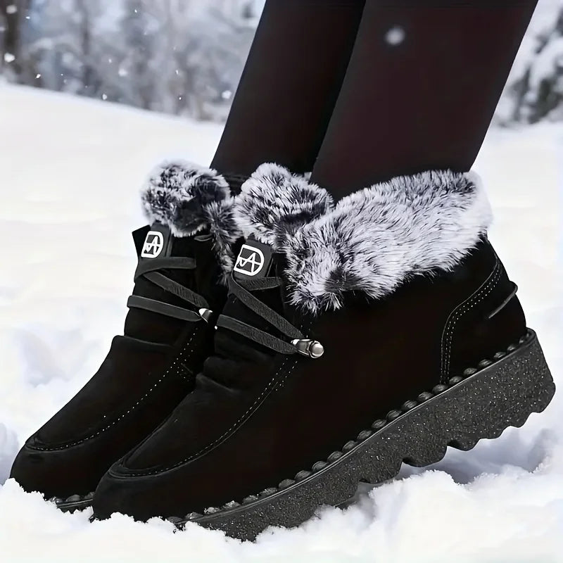 Women's black lace-up snow boots with faux-fur cuffs and grippy lug sole