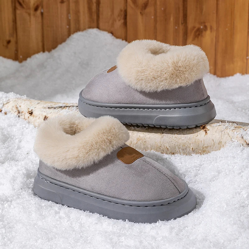 Women's gray winter snow boots with fluffy trim, slip-on suede upper, and grippy sole