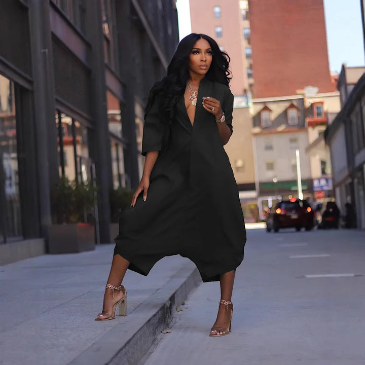 Black loose harem jumpsuit with V-neck and three-quarter sleeves with wide legs