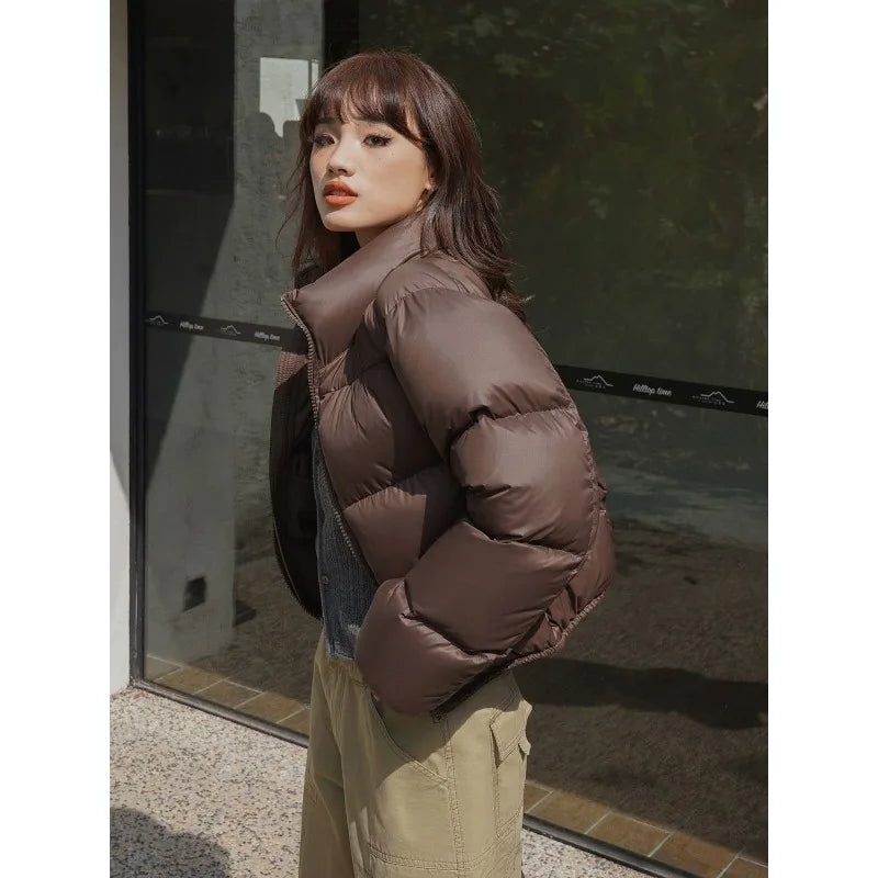 Women wearing brown thick padded puffer coat.