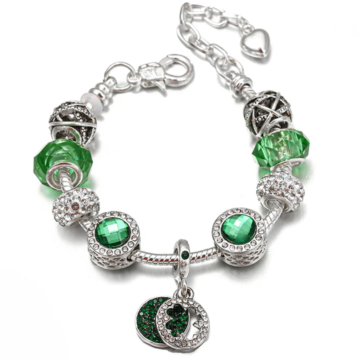 Silver charm bracelet with green crystal beads and a rhinestone heart pendant charm