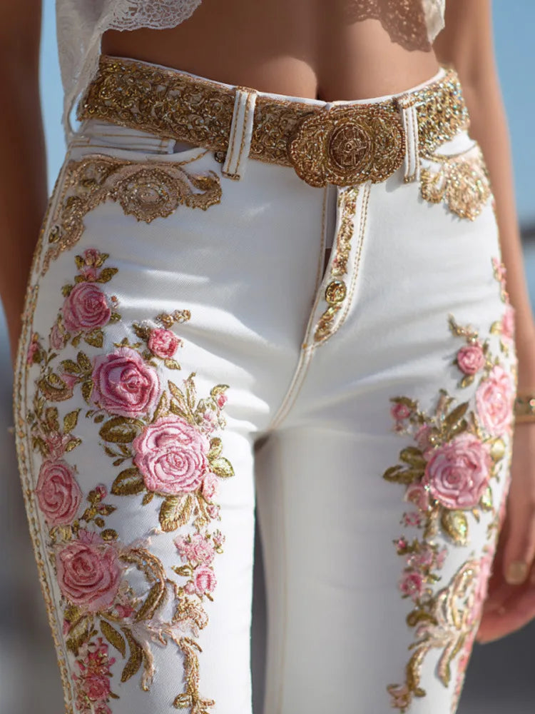 White denim jeans with high waist and straight legs, pink rose embroidery with gold trim