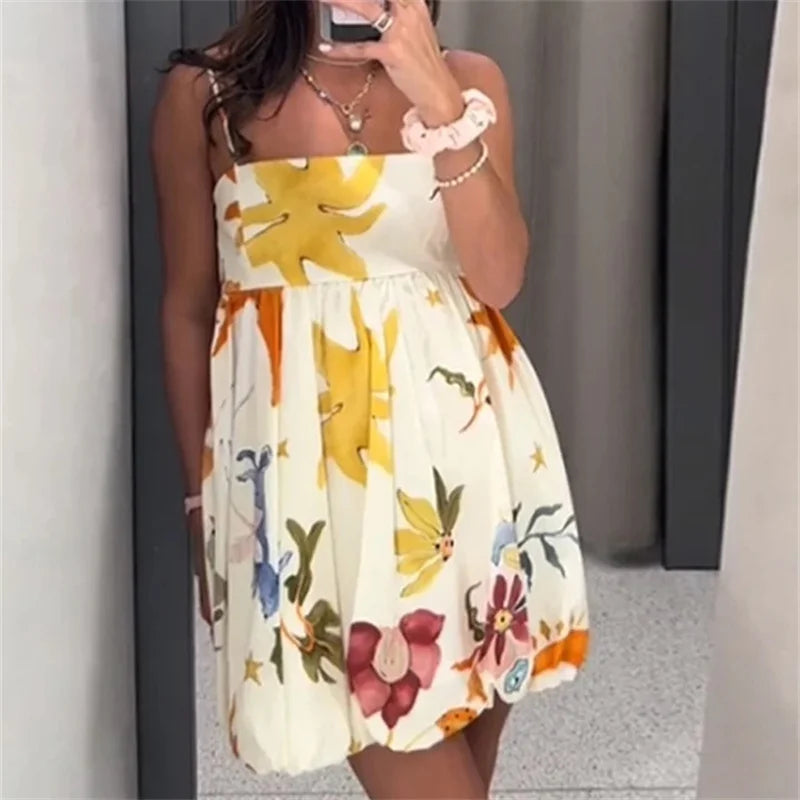 Woman wearing a colorful floral dress in an indoor setting