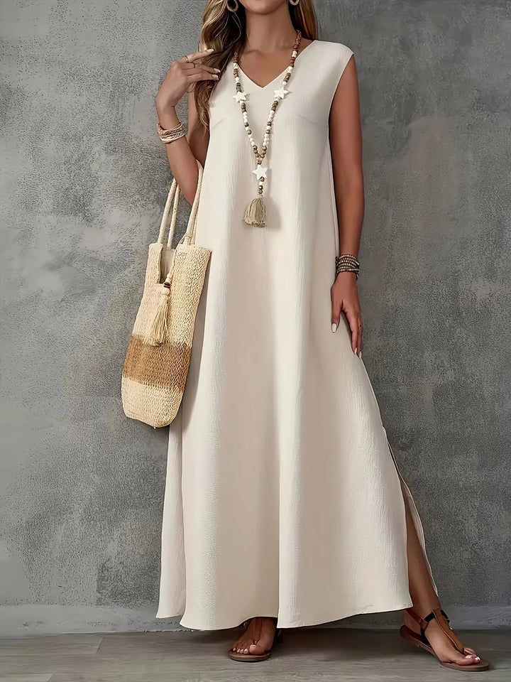 Beiges ärmelloses Maxikleid mit V-Ausschnitt, vorderem Schlitz und Quasten-Detail