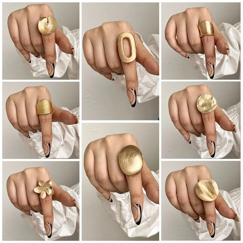 Gold tone statement mood rings with floral, oval, and ridged designs