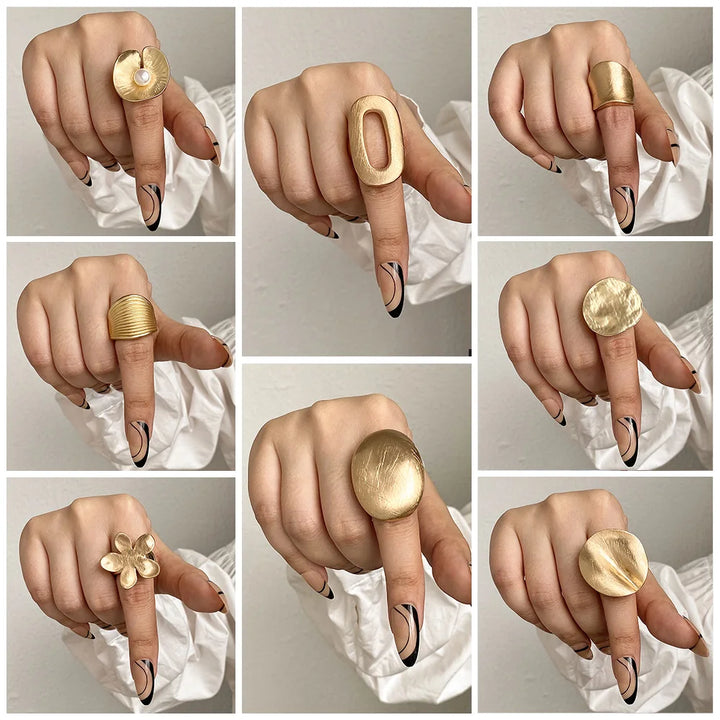 Gold tone statement mood rings with floral, oval, and ridged designs