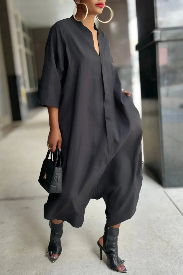 Black loose harem jumpsuit with V-neck, kimono sleeves, and side pockets