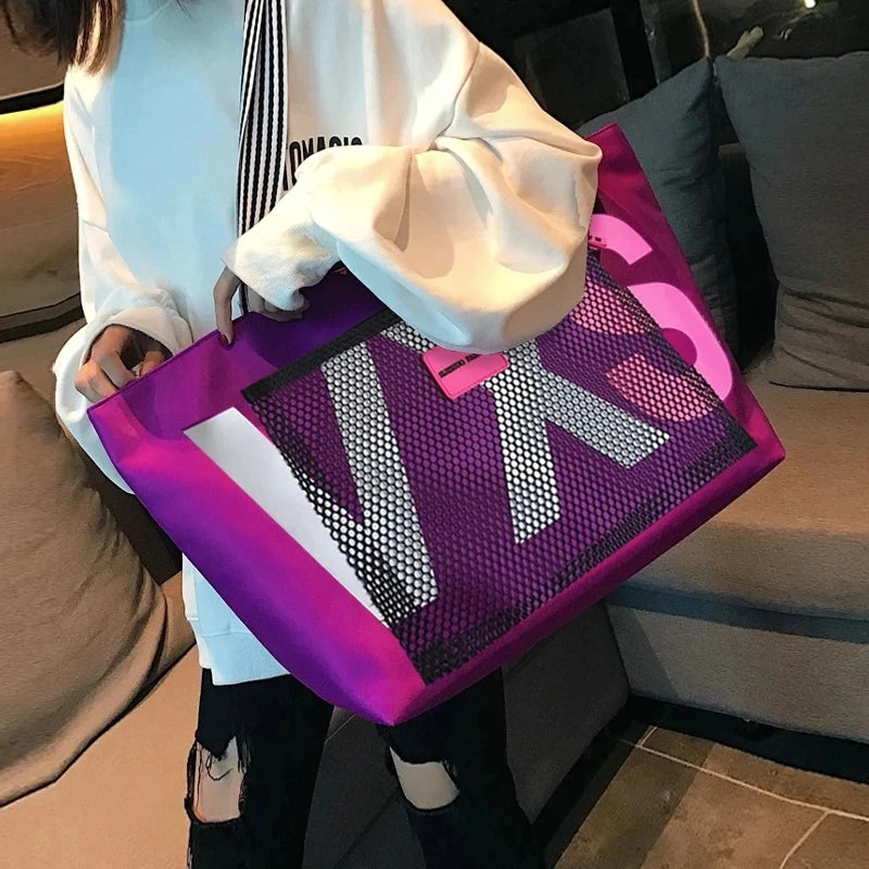 PURPLE waterproof tote bag with large white letter print, pink accents, and top zip