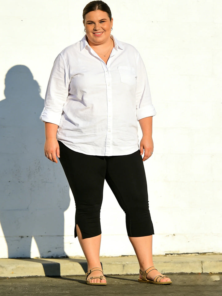 Black high-waist capri leggings with side slits
