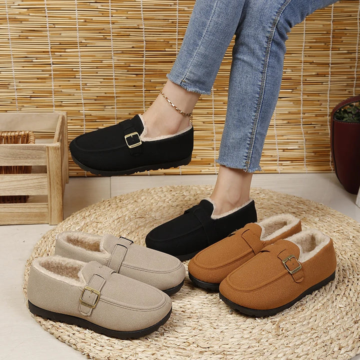 Slip-on loafers in beige, black, and brown with gold buckles and plush lining