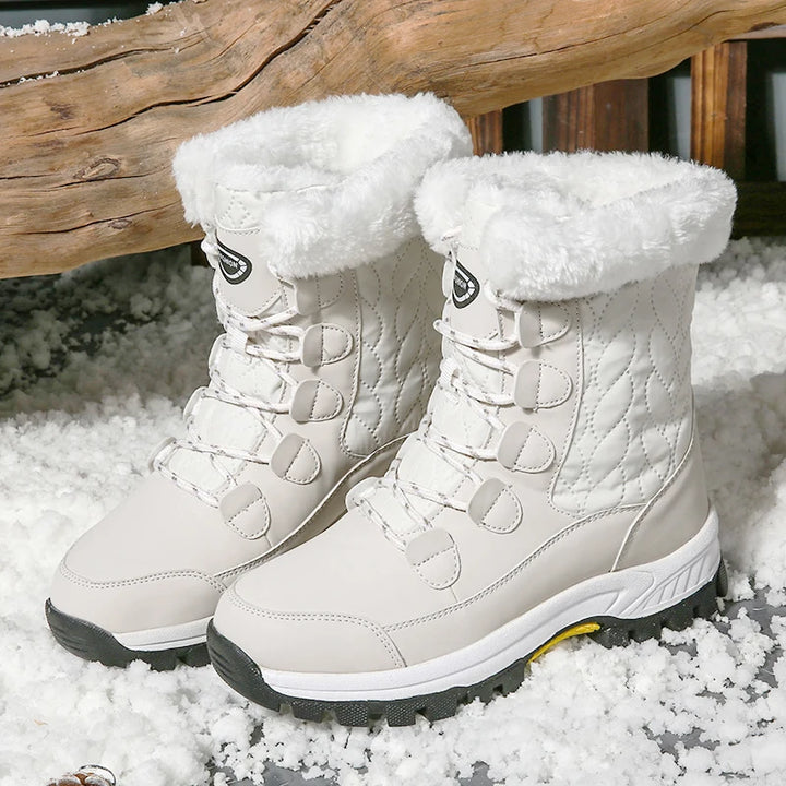 Women's white mid-calf lace-up snow boots with thick fleece lining and non-slip outsole