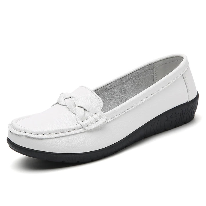 White shoe with a black sole on a white background
