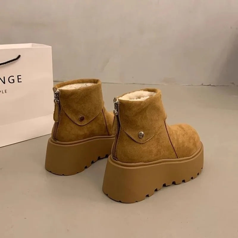Tan wool-lined ankle boots with button strap and chunky platform sole