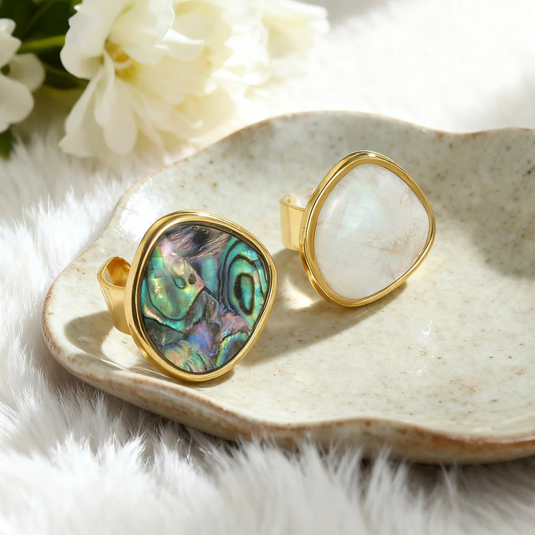 Gold open ring set with oval abalone shell inlay, iridescent teal-purple and white