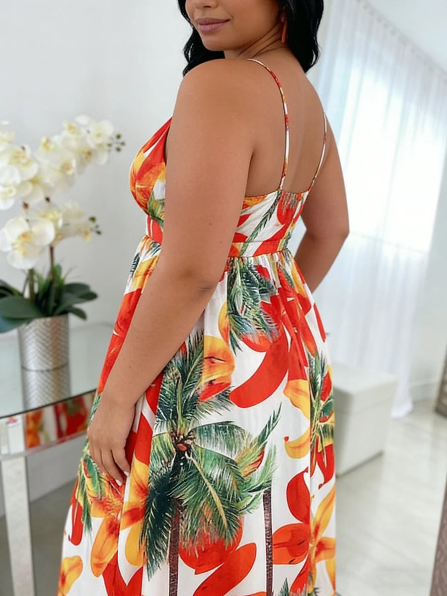 Woman wearing a tropical print dress with palm trees and flowers indoors.