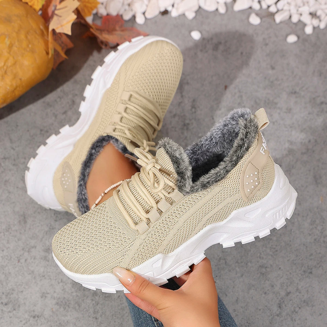 Women’s beige knit lace-up snow sneakers with plush gray lining and rugged tread sole