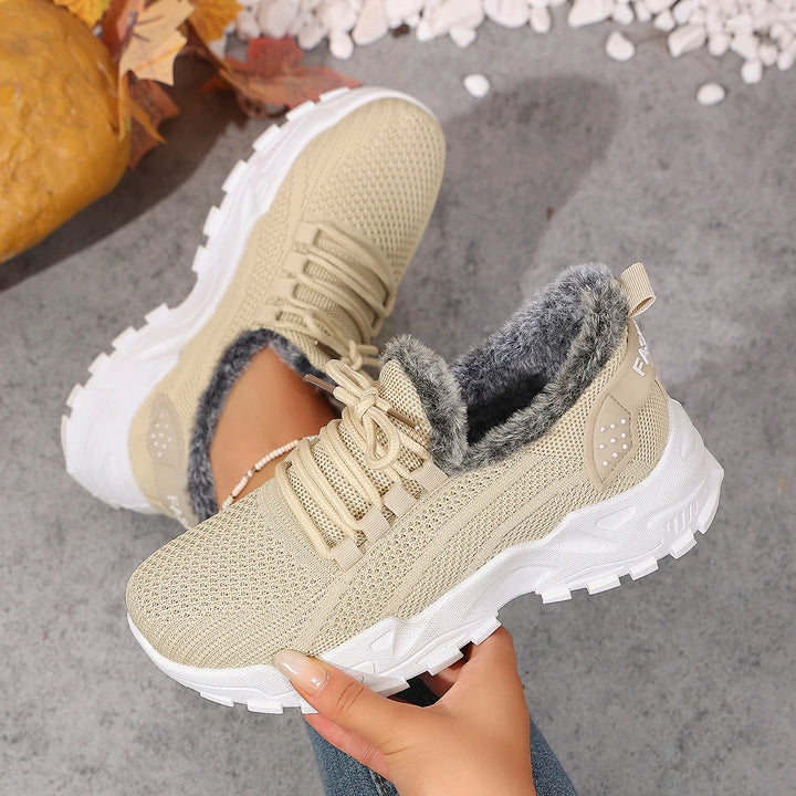Women’s beige knit lace-up snow sneakers with plush gray lining and rugged tread sole