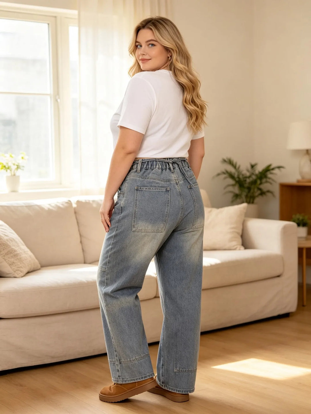 Light blue denim cargo jeans shown from the side with drawstring waist and cargo pocket