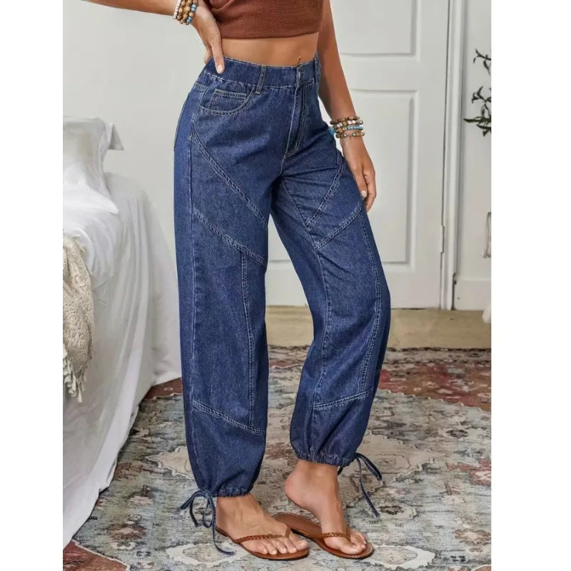 High-waist loose denim jeans in dark blue with side pockets and lace-up drawstring hem