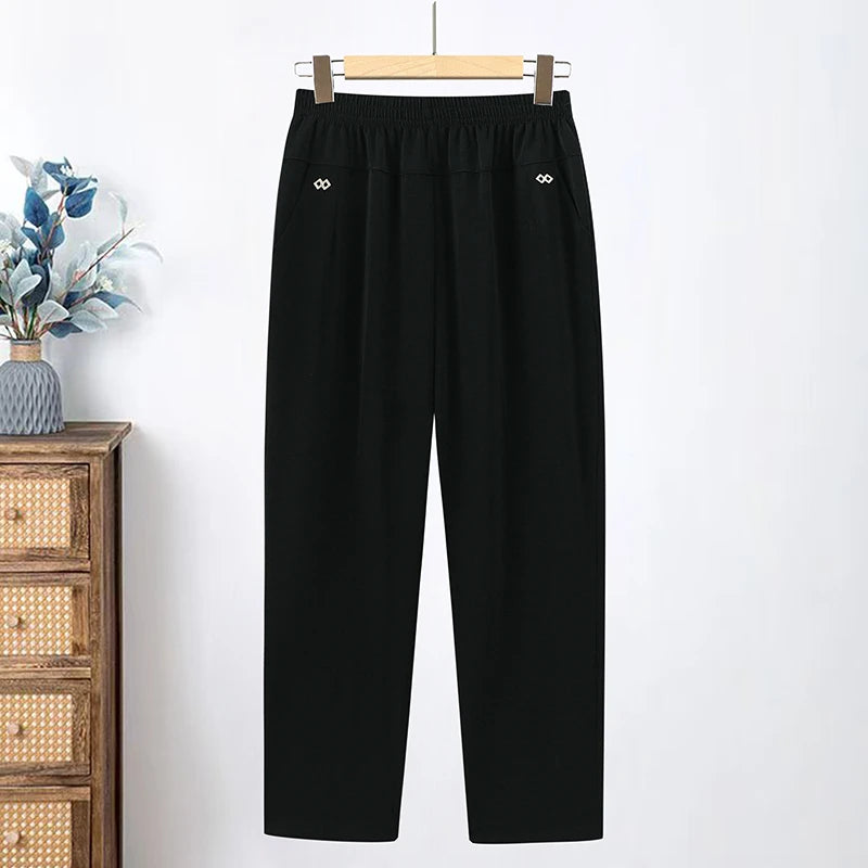 Black loose pants with an elastic waist and angled pockets
