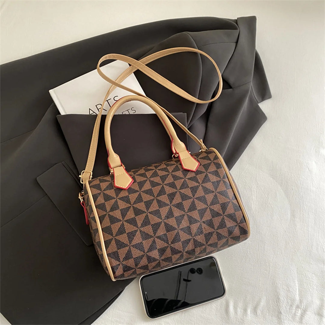 Coffee-brown PU handbag with geometric triangle pattern, top handles, and adjustable strap