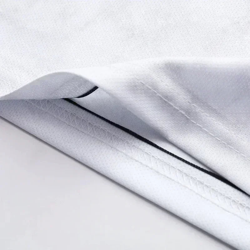 White knit jersey fabric with black-trim edge seam detail close-up