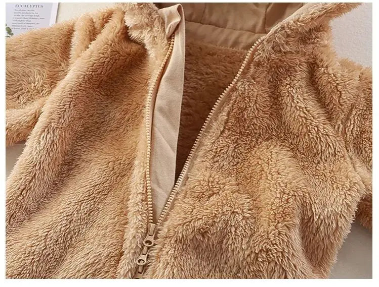 Close-up of a fluffy beige jacket with a zipper